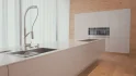 tracking-shot-of-a-large-white-luxury-kitchen-SBI-350656229